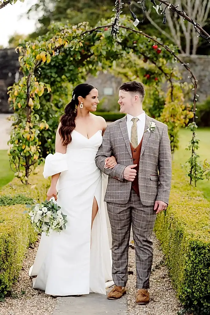bride-groom-walking-coombe-lodge-gardens