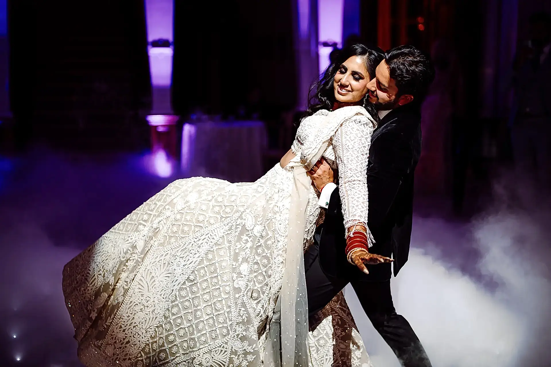 groom catches his bride as they perform their first dance at clevedon hall