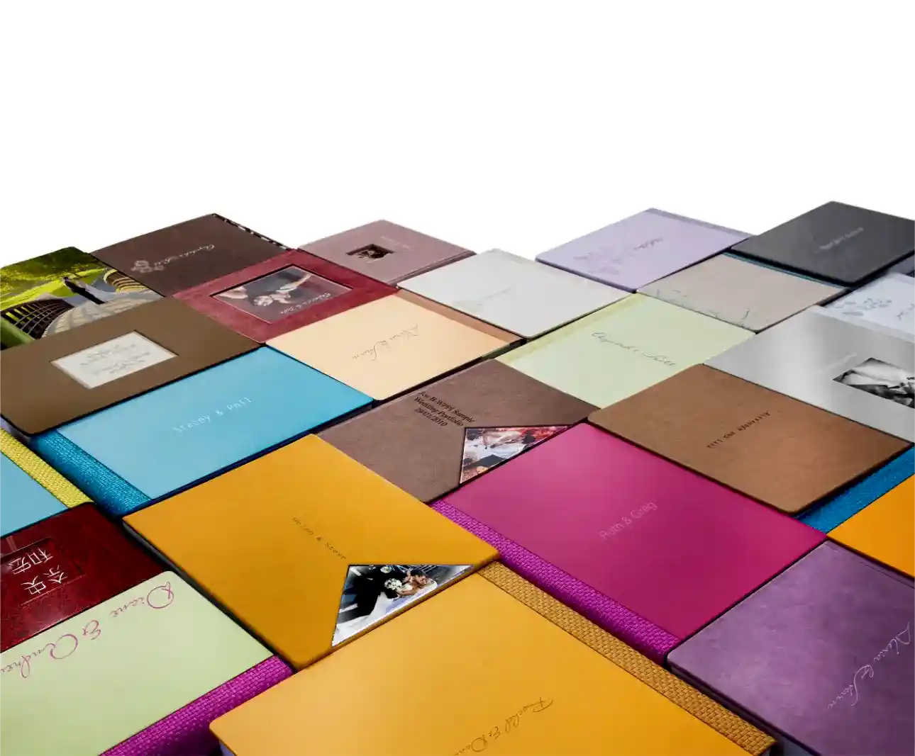 wedding albums layed out to see various designs and colours